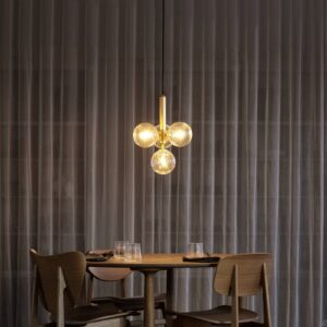 Svítidlo Nuura Aps mosaz/čirá sklo ručně foukané/kov s práškovým lakem